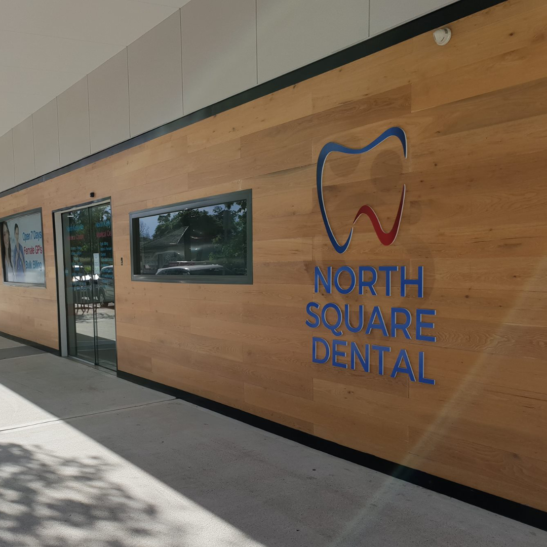 North Square Dental clinic, from outside, showing windows and doors.